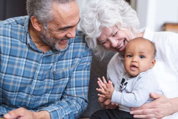 cremation options grandparents holding baby